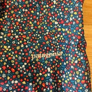 Patagonia Navy Floral Print Jacket with Red, Yellow & White Accents